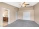 Large bedroom with a ceiling fan, an ensuite bathroom and a closet at 10845 W Quail Ave, Peoria, AZ 85373