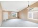 Bright living room featuring carpet, a front door, and a large window at 10845 W Quail Ave, Peoria, AZ 85373