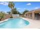 Refreshing pool with palm trees and a storage shed in a well-maintained backyard at 10845 W Quail Ave, Peoria, AZ 85373