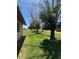 Expansive backyard with mature trees, grassy areas, and a serene environment at 121 E Ivanhoe St, Gilbert, AZ 85295