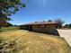 A single story home with a well maintained yard and a paved driveway at 121 E Ivanhoe St, Gilbert, AZ 85295