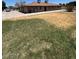 Single-story brick house features a well-manicured lawn and a paved driveway at 121 E Ivanhoe St, Gilbert, AZ 85295