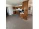 Traditional kitchen with wood cabinets, complete with black appliances at 121 E Ivanhoe St, Gilbert, AZ 85295