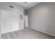 Bright bedroom featuring carpeted floors, ample closet space and neutral walls at 1231 W Mediterranean Dr, Gilbert, AZ 85233