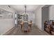 Bright dining room featuring stylish furniture, a chandelier, and natural light with views to kitchen at 1231 W Mediterranean Dr, Gilbert, AZ 85233