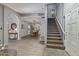 Inviting foyer showcasing tile floors, a staircase and an archway leading to the dining room with great light at 1231 W Mediterranean Dr, Gilbert, AZ 85233