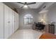 Home office features built-in cabinets, a desk, and a bright window for a workspace at 1231 W Mediterranean Dr, Gilbert, AZ 85233