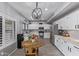 Kitchen with wood tile floors, stainless steel appliances, and bright white cabinets at 1231 W Mediterranean Dr, Gilbert, AZ 85233