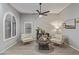 Cozy living room with neutral walls, stylish furniture, and natural light with lovely flooring throughout at 1231 W Mediterranean Dr, Gilbert, AZ 85233
