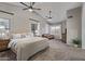 Spacious main bedroom with ceiling fans, carpet floors, and curtains at 1231 W Mediterranean Dr, Gilbert, AZ 85233