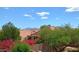 Landscaped backyard view showing a home with a red tile roof and mountain views at 14021 N 29Th St, Phoenix, AZ 85032
