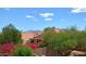 Backyard view highlights lush landscaping, a view of neighboring houses and scenic mountains on the horizon at 14021 N 29Th St, Phoenix, AZ 85032