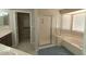 Bathroom featuring a separate shower and tub, plus a large walk-in closet for ample storage at 14021 N 29Th St, Phoenix, AZ 85032