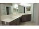 This bathroom has a double sink vanity, an overhead mirror, and plenty of storage space at 14021 N 29Th St, Phoenix, AZ 85032