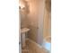 Bathroom featuring a pedestal sink, tub/shower combo, and tiled floor offers a clean, simple design at 14021 N 29Th St, Phoenix, AZ 85032