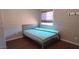 Bedroom featuring hardwood floors, a double bed, and window with privacy blind at 14021 N 29Th St, Phoenix, AZ 85032