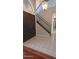 Inviting foyer featuring tile flooring, a staircase, and modern lighting at 14021 N 29Th St, Phoenix, AZ 85032