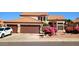 Charming home featuring a tile roof, two-car garage, and beautiful bougainvillea at 14021 N 29Th St, Phoenix, AZ 85032