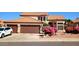 Inviting home featuring a well-manicured yard and attached two-car garage with a tile roof at 14021 N 29Th St, Phoenix, AZ 85032