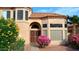 Inviting front entrance with a wrought iron security door and colorful landscaping at 14021 N 29Th St, Phoenix, AZ 85032