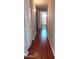 Hallway with hardwood floors leading to a bathroom at 14021 N 29Th St, Phoenix, AZ 85032