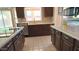Bright kitchen boasts stainless appliances, a large window and tiled flooring at 14021 N 29Th St, Phoenix, AZ 85032