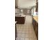 Open kitchen showcases a large island, ample storage, and stylish tile flooring at 14021 N 29Th St, Phoenix, AZ 85032