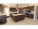 Spacious kitchen features a large island, stainless steel appliances, and ample cabinet space at 14021 N 29Th St, Phoenix, AZ 85032