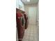 Laundry room with side-by-side washer and dryer set includes tiled floors and ample space at 14021 N 29Th St, Phoenix, AZ 85032