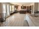 Open-concept living area flows from the kitchen, featuring tile floors and natural light at 14021 N 29Th St, Phoenix, AZ 85032