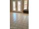 Bright living space with unique tile flooring, patio access and an entertainment area at 14021 N 29Th St, Phoenix, AZ 85032