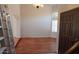 Bright living room featuring hardwood floors, arched doorway, and natural light at 14021 N 29Th St, Phoenix, AZ 85032