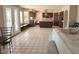 Open concept living space featuring tile floors, natural light, and a kitchen at 14021 N 29Th St, Phoenix, AZ 85032