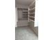 Spacious walk-in closet with shelving and hanging rods, providing ample storage space at 14021 N 29Th St, Phoenix, AZ 85032