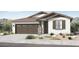 Charming single-story home featuring a two-car garage, neutral stucco exterior, and stylish brown accents at 14385 W Sand Hills Rd, Surprise, AZ 85387