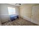 Neutral bedroom featuring a ceiling fan, window, desk, closet, and door at 14620 N Yerba Buena Way # B, Fountain Hills, AZ 85268