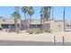 Attractive building exterior with desert landscaping, palm trees, and shade trees at 14620 N Yerba Buena Way # B, Fountain Hills, AZ 85268