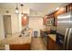 Well-appointed kitchen with stainless steel appliances, granite counters, and stylish pendant lighting at 14620 N Yerba Buena Way # B, Fountain Hills, AZ 85268