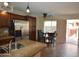 Modern kitchen with stainless steel appliances, granite countertops, and a dining area for comfortable meals at 14620 N Yerba Buena Way # B, Fountain Hills, AZ 85268