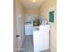 Coin operated laundry room includes washer, dryer, water heater, shelving and 'resident use only' sign at 14620 N Yerba Buena Way # B, Fountain Hills, AZ 85268