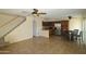 Open-concept living room and kitchen with tile flooring, stairs, and bright, natural light throughout at 14620 N Yerba Buena Way # B, Fountain Hills, AZ 85268