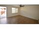 Open living room with ceramic tile flooring, ceiling fan and natural light at 14620 N Yerba Buena Way # B, Fountain Hills, AZ 85268