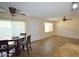 Inviting living room and dining area with tile floors, ceiling fans, and ample natural light at 14620 N Yerba Buena Way # B, Fountain Hills, AZ 85268