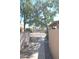 Walkway features rocks, bushes, a wall, and a view to other landscaping and neighborhood in distance at 14620 N Yerba Buena Way # B, Fountain Hills, AZ 85268