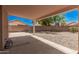Back yard with a covered patio, a rock yard, and block fence at 15440 S 38Th St, Phoenix, AZ 85044