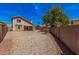 View of the back yard with a covered patio and a rock yard at 15440 S 38Th St, Phoenix, AZ 85044
