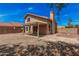 Two story home with a covered patio, a rock yard, and a chimney at 15440 S 38Th St, Phoenix, AZ 85044