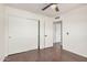 Bedroom featuring wood floors and a closet at 15440 S 38Th St, Phoenix, AZ 85044