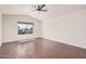 Bedroom featuring a ceiling fan and wood floors at 15440 S 38Th St, Phoenix, AZ 85044