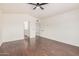 Spacious bedroom featuring wood floors and a ceiling fan at 15440 S 38Th St, Phoenix, AZ 85044